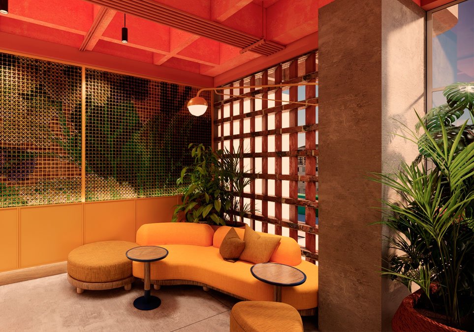 Espacio lounge en el hotel Ibis Styles Medellín con sofás modernos y decoración colorida