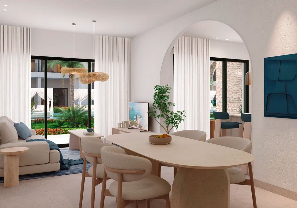 Sala y comedor elegantes en residencia de lujo con ventanales amplios, decoración minimalista y vista a jardines en Inverza