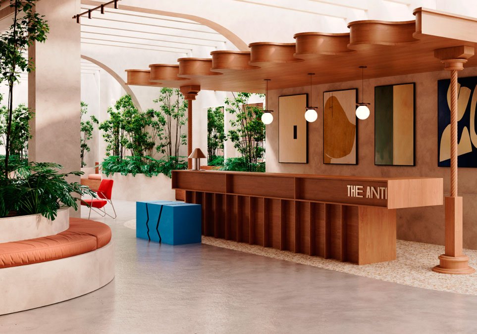 Lobby de recepción en The Anti Galerie Hotel en Cartagena, diseño moderno con arte contemporáneo y vegetación interior.